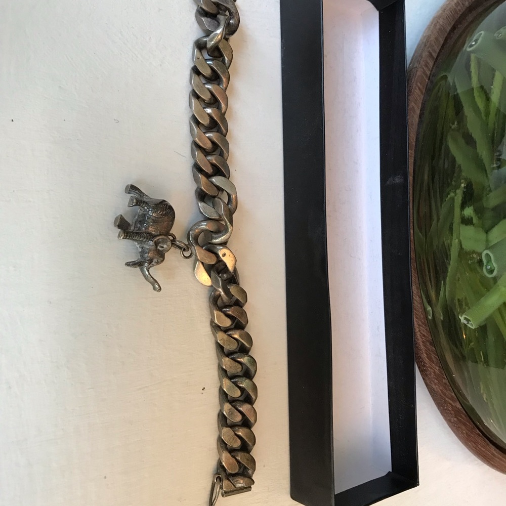 Chunky metal bracelet with elephant charm
